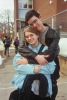 Heather and Dan Cuddling In Front Of School